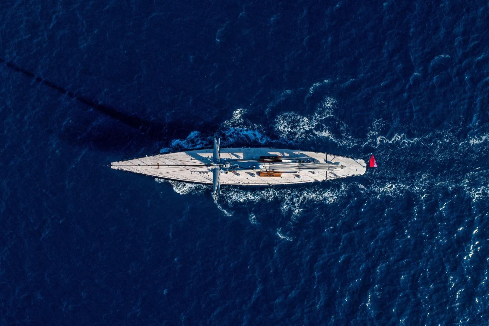 a plane flying over a sea aboard RAINBOW Yacht for Sale
