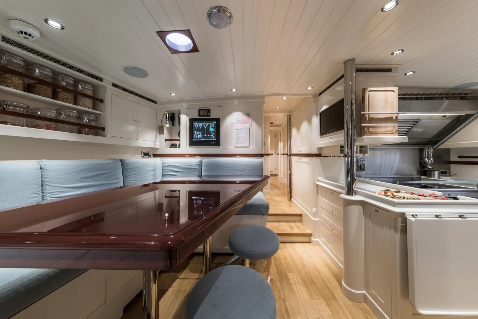 a kitchen with a bar and a bar aboard RAINBOW Yacht for Sale