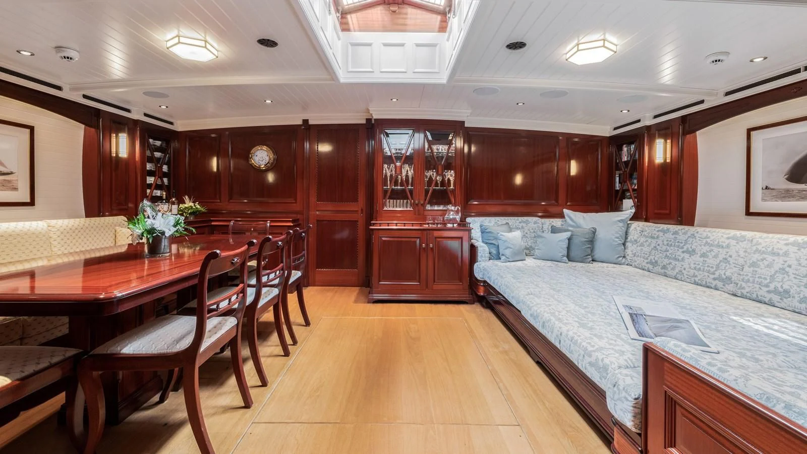a bedroom with a bed and a table aboard RAINBOW Yacht for Sale