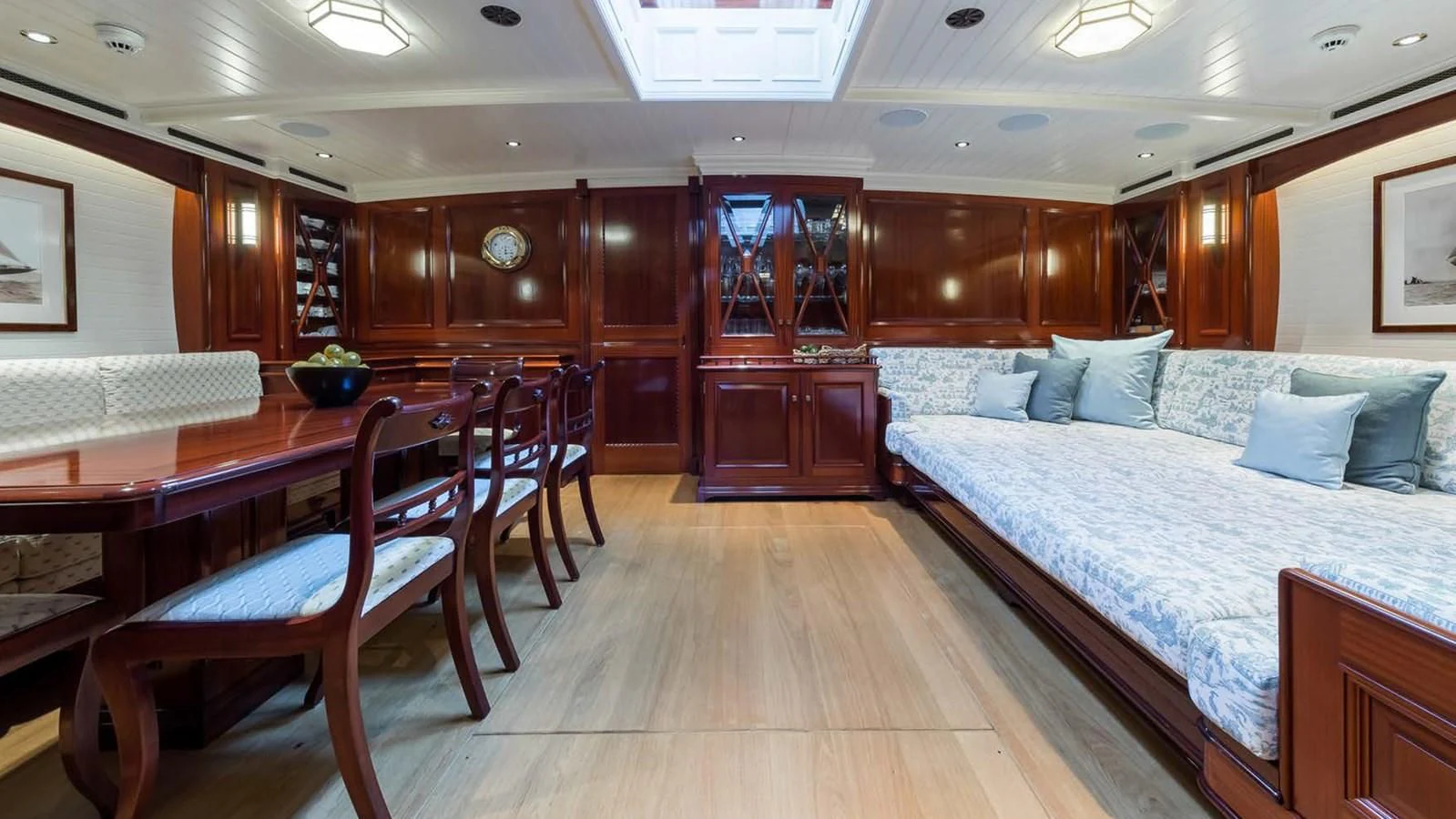 a bed and a table in a room aboard RAINBOW Yacht for Sale