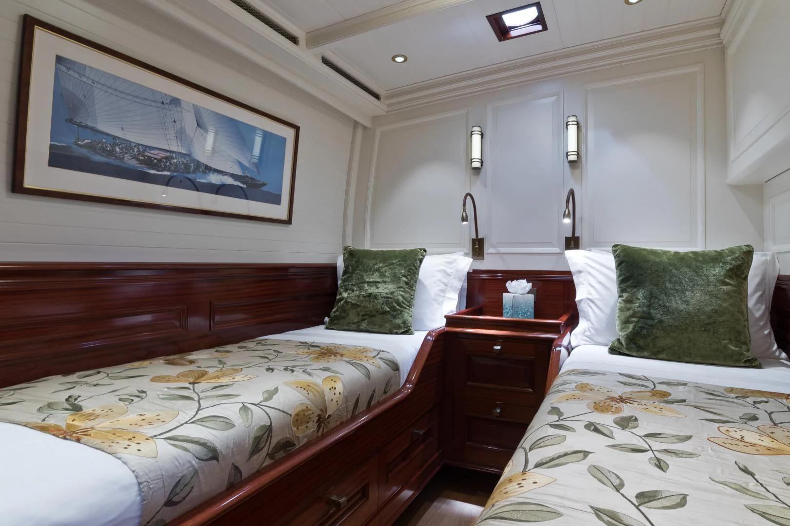 a couple of beds in a room aboard RAINBOW Yacht for Sale