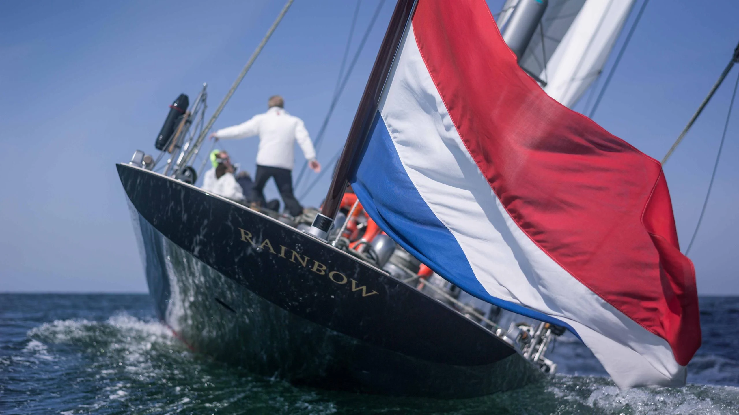 a boat with a red and white sail aboard RAINBOW Yacht for Sale