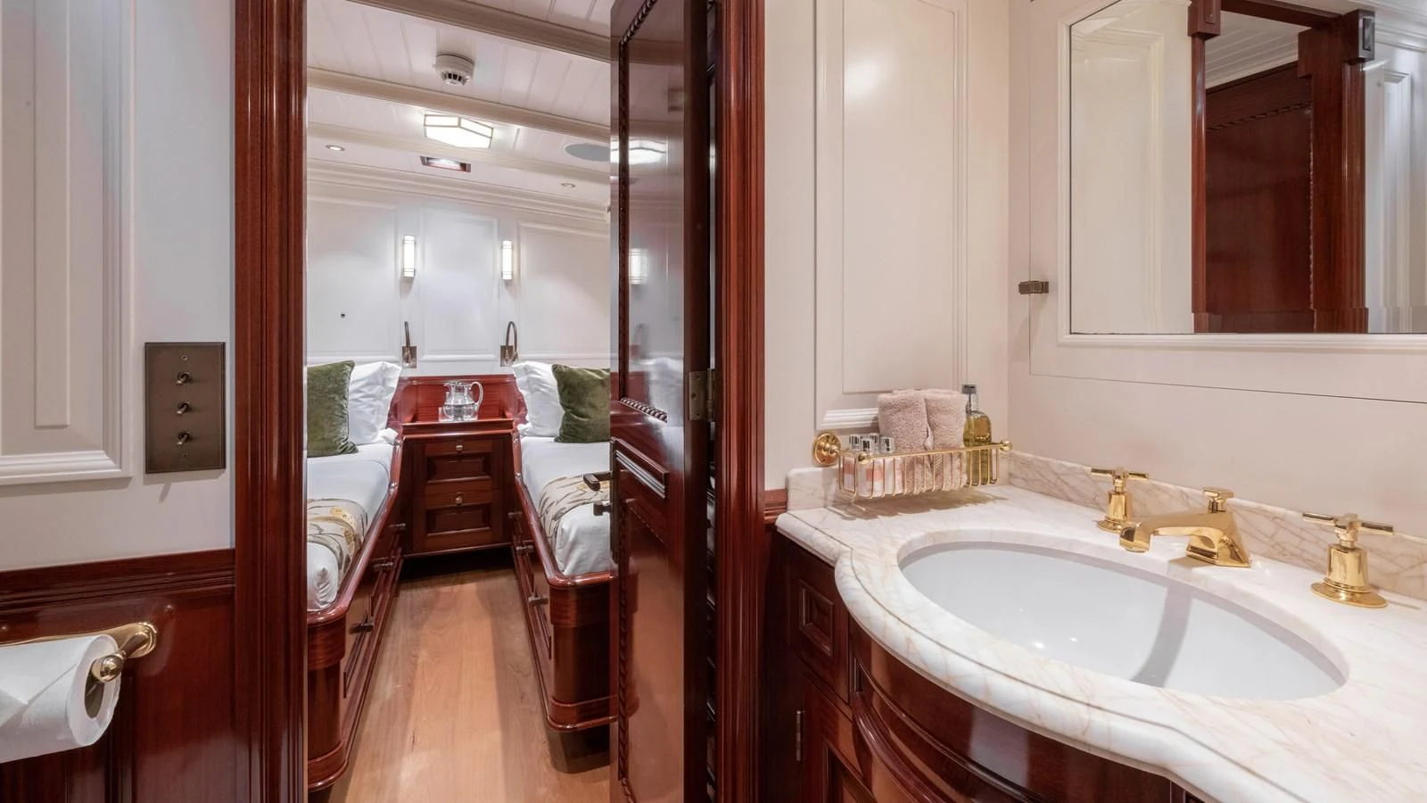 a bathroom with a sink and a mirror aboard RAINBOW Yacht for Sale