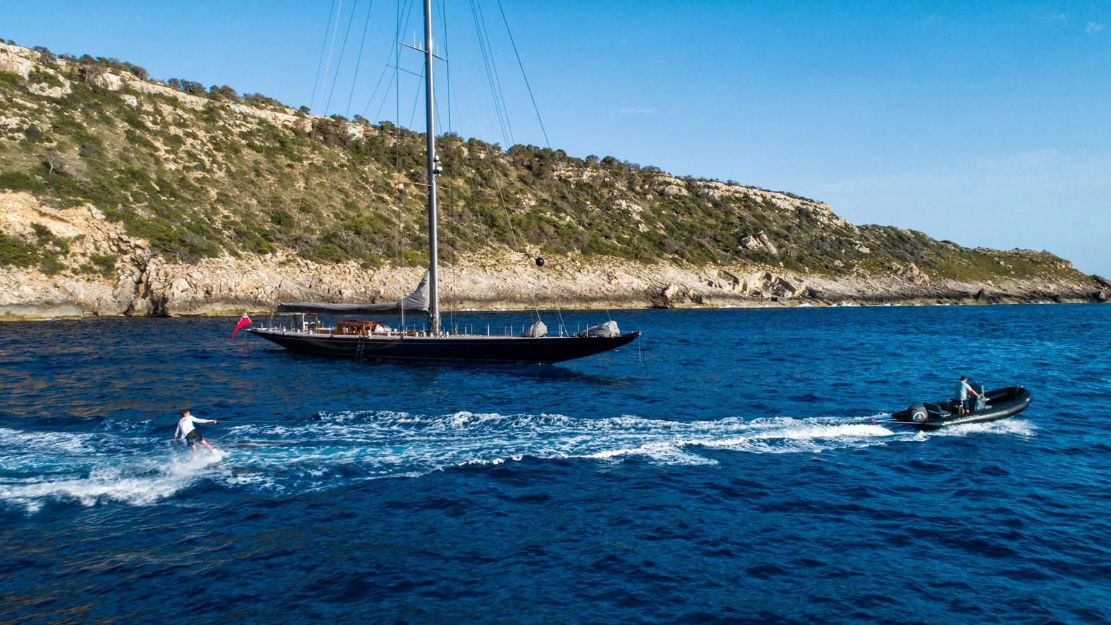a boat sailing in the sea aboard RAINBOW Yacht for Sale