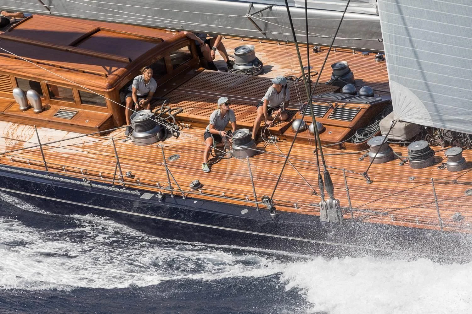 a boat with a few men aboard RAINBOW Yacht for Sale