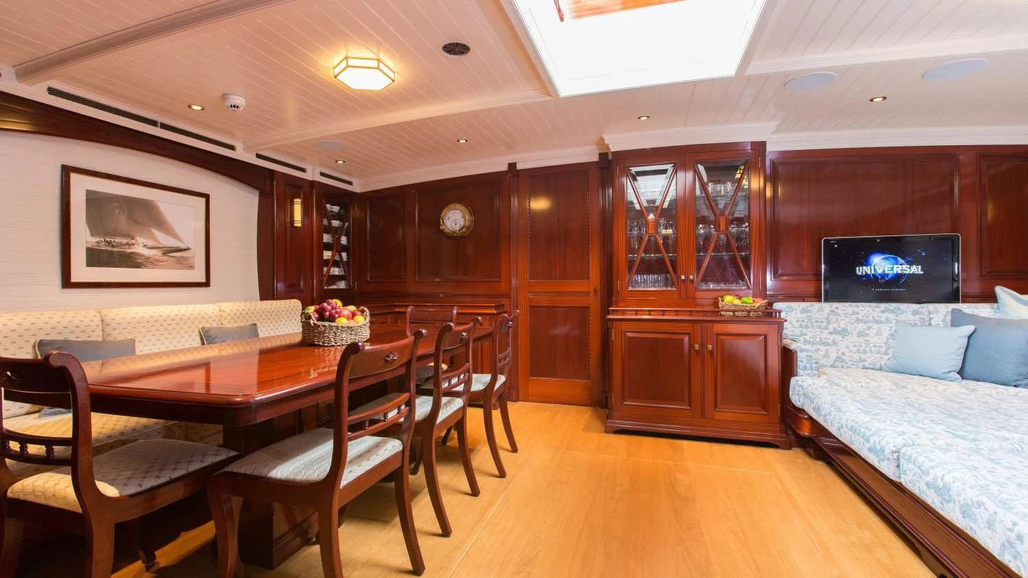 a living room with a wood floor aboard RAINBOW Yacht for Sale