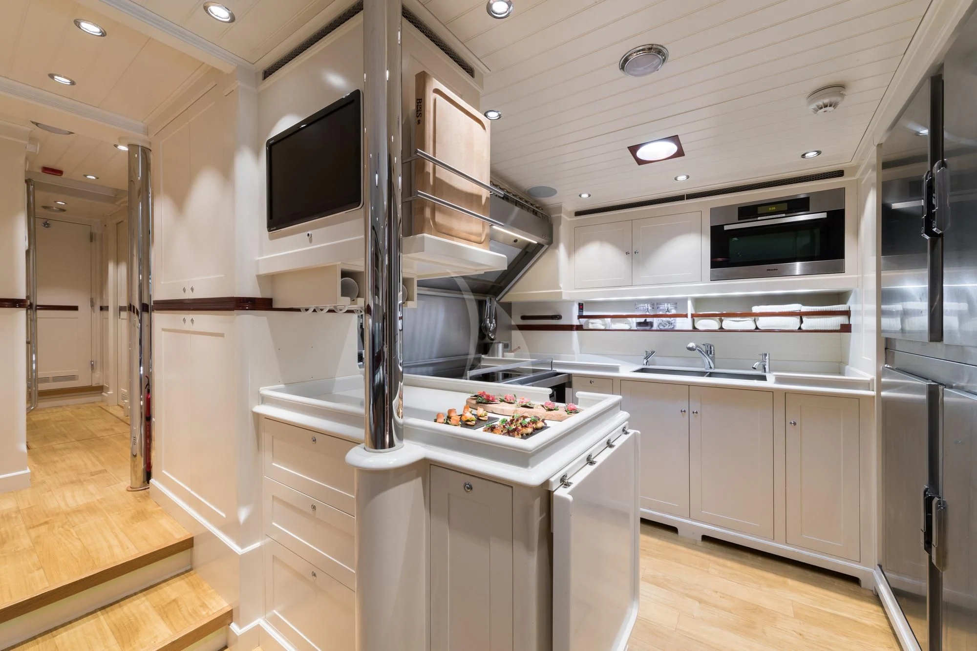 a kitchen with a large stove aboard RAINBOW Yacht for Sale