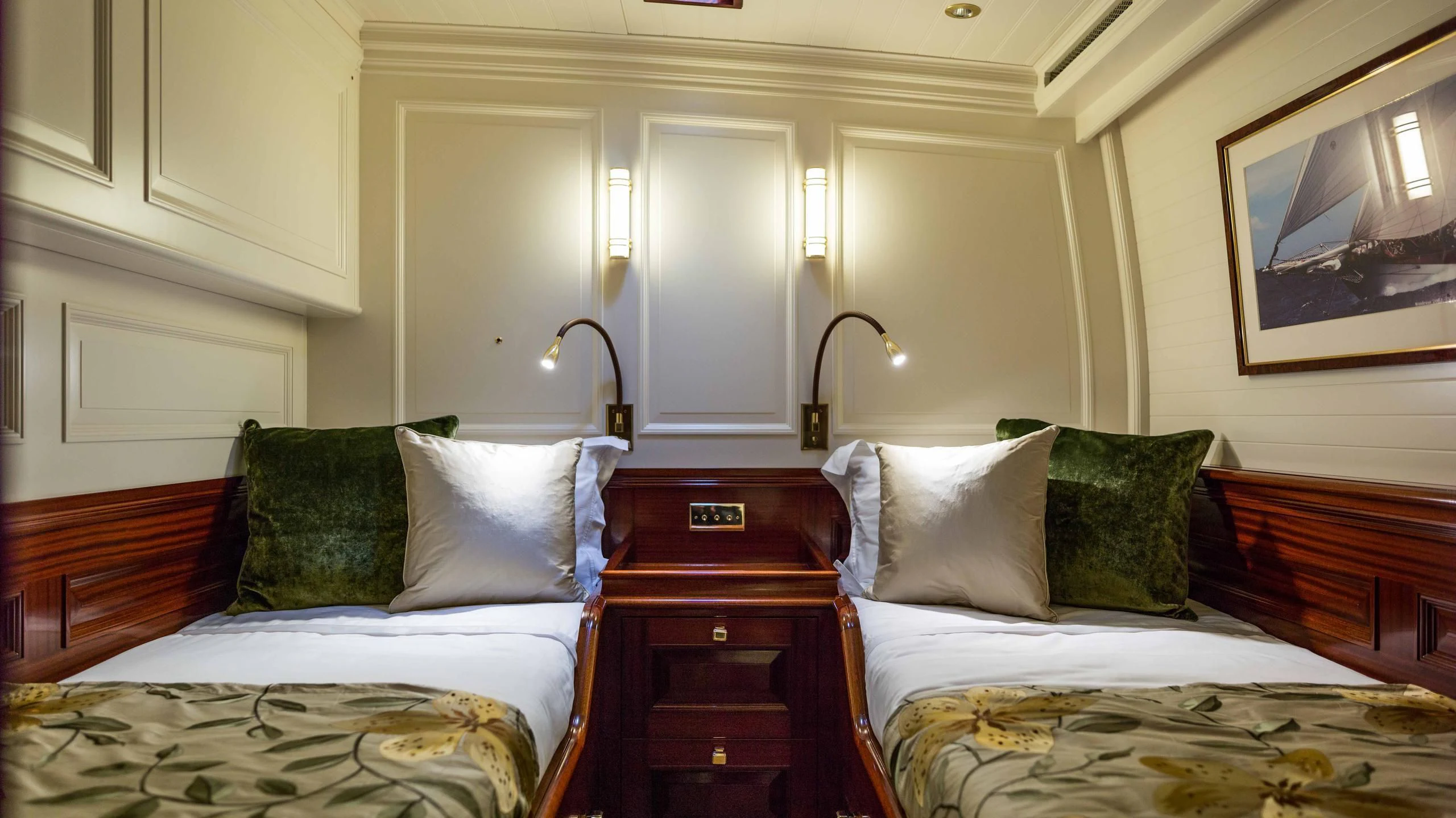 a room with two beds aboard RAINBOW Yacht for Sale