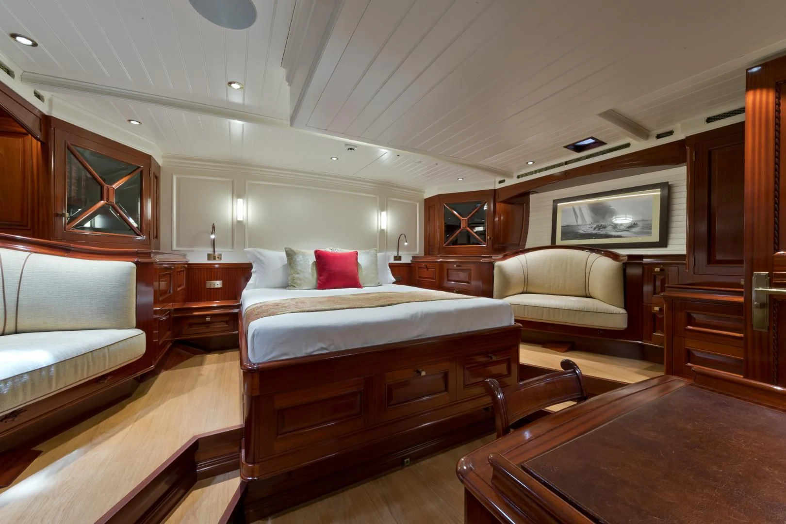 a room with a bed and a couch aboard RAINBOW Yacht for Sale
