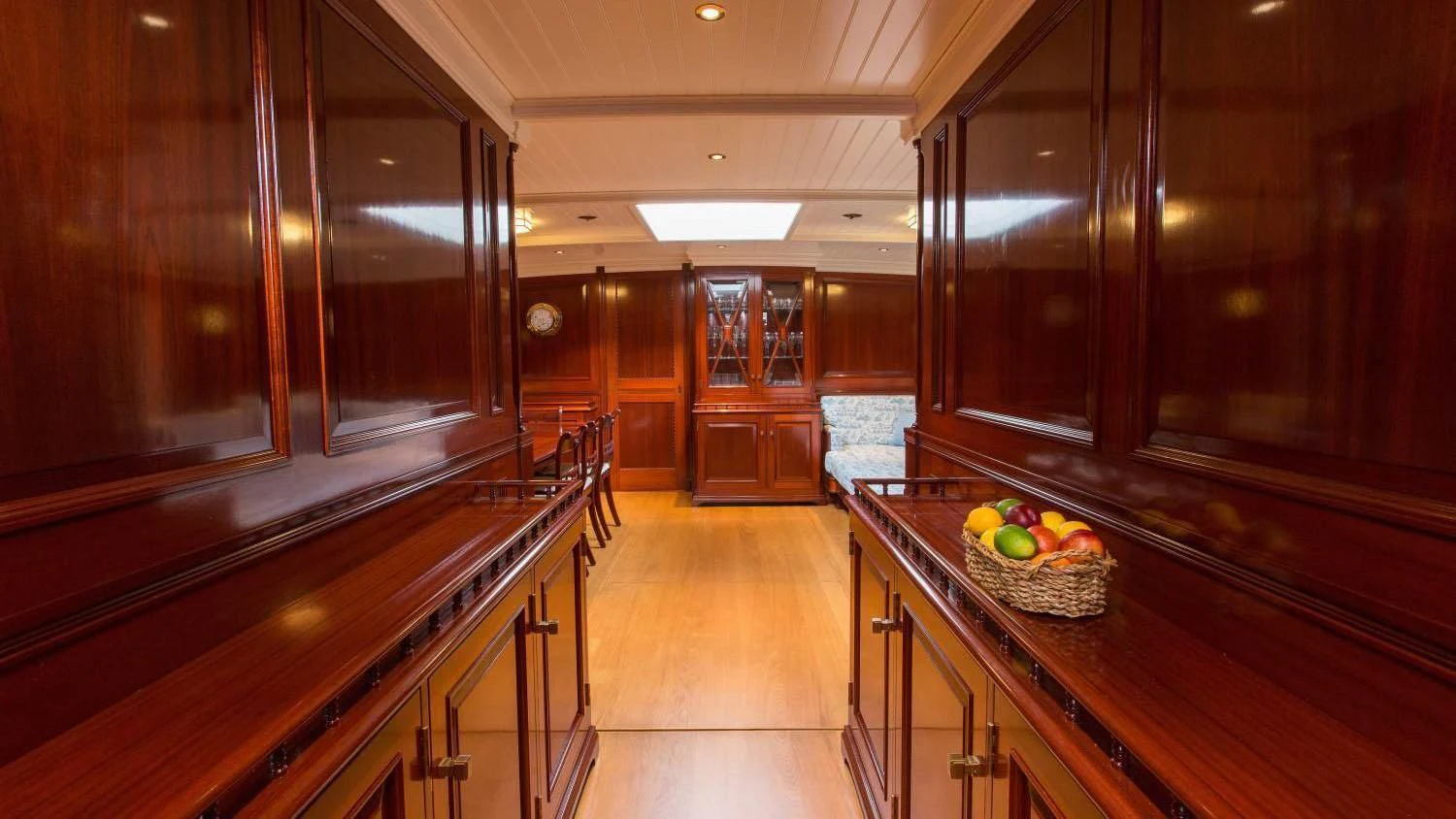 a kitchen with wooden cabinets aboard RAINBOW Yacht for Sale