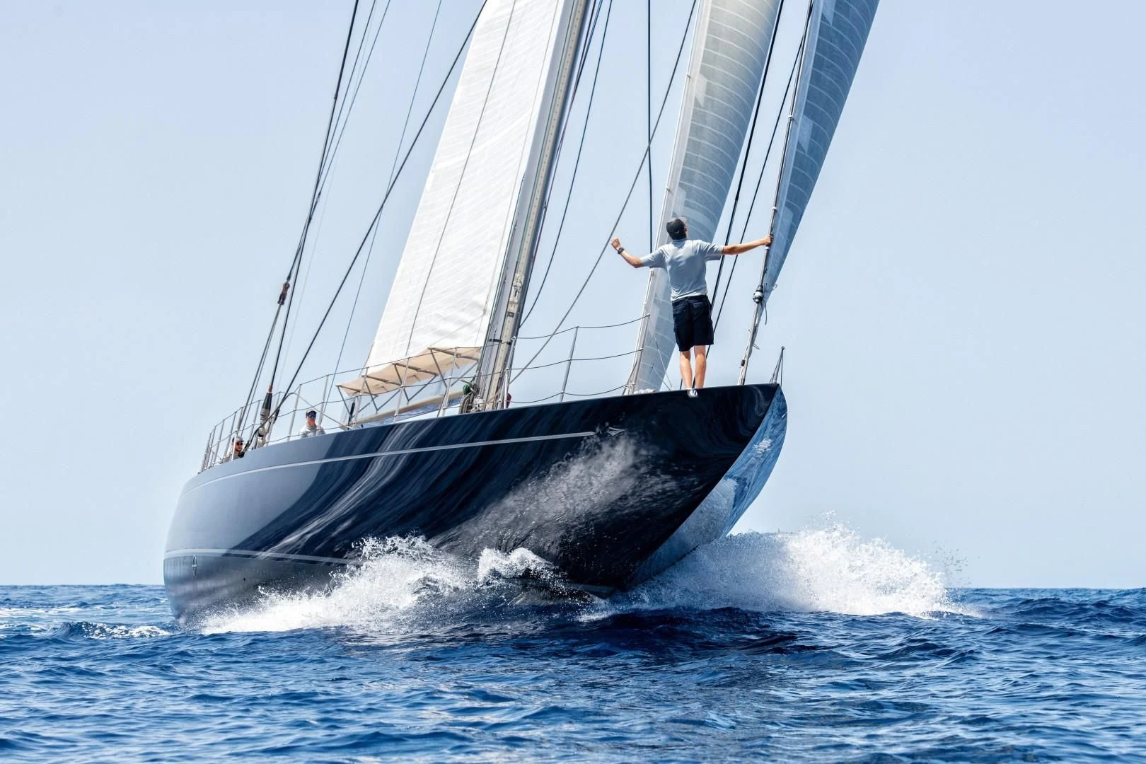 a man on a sailboat aboard RAINBOW Yacht for Sale