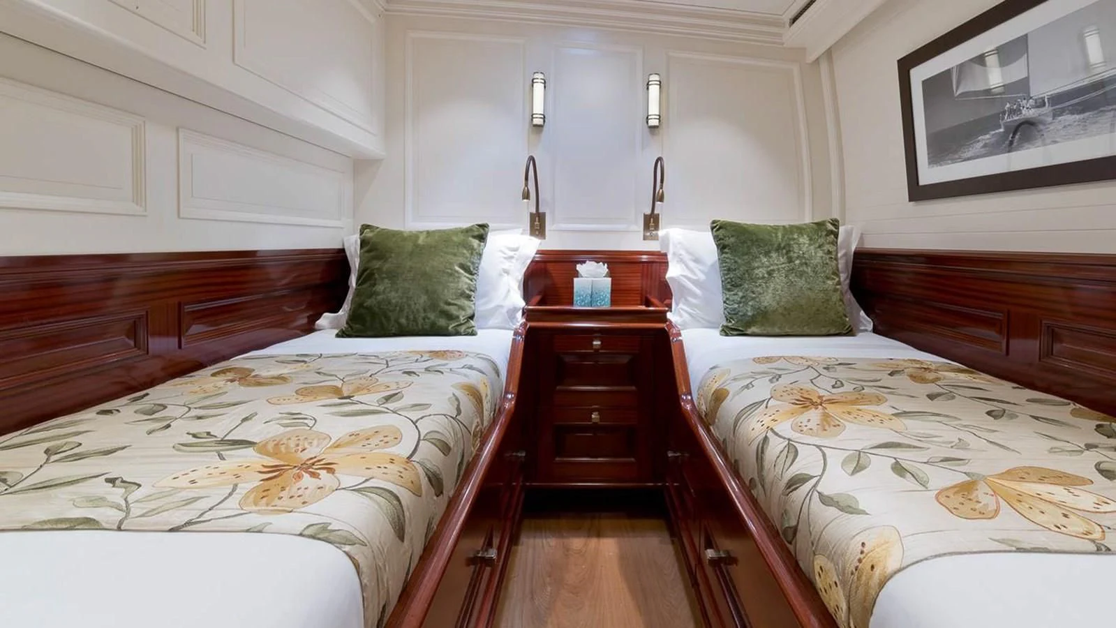 a couple of beds in a room aboard RAINBOW Yacht for Sale