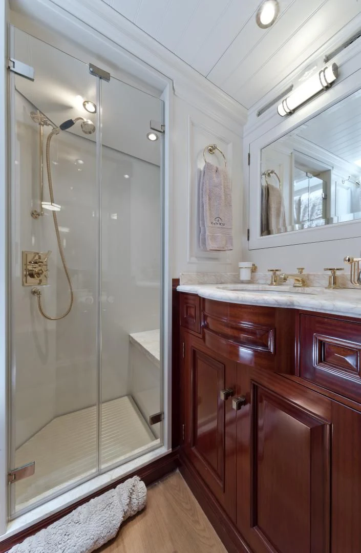 a bathroom with a shower unit and sink aboard RAINBOW Yacht for Sale