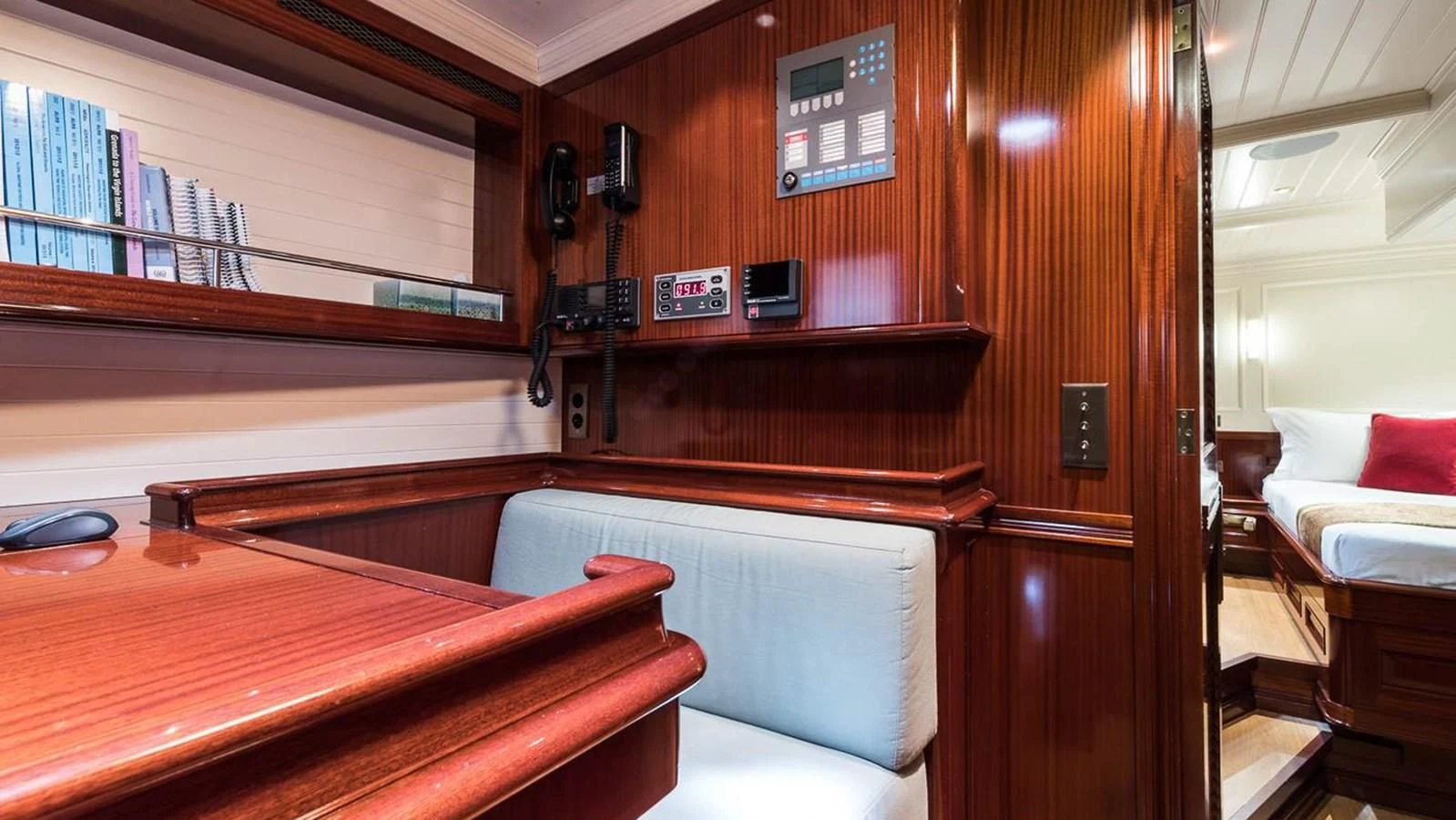 a room with a bed and a desk aboard RAINBOW Yacht for Sale
