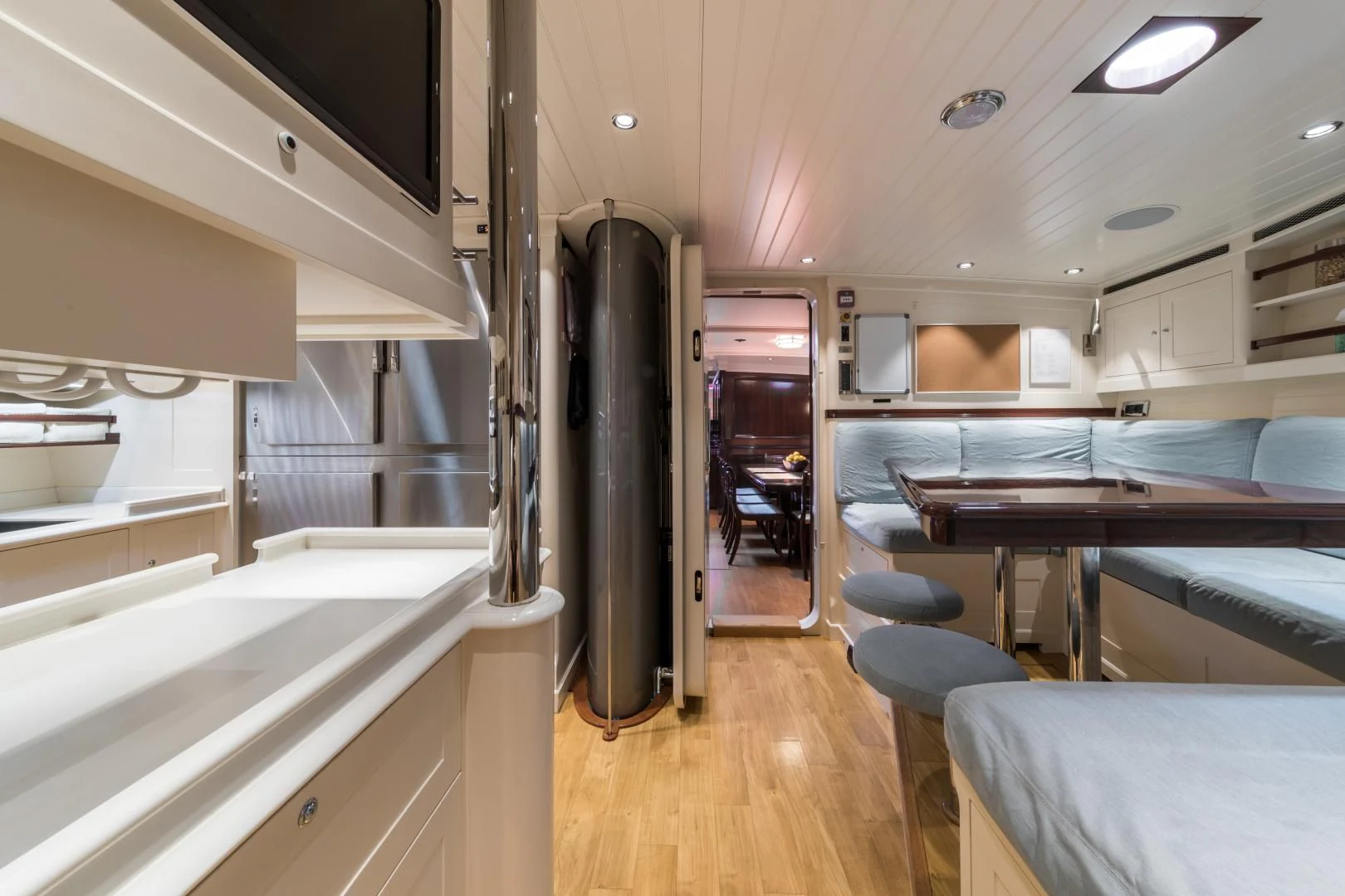 a room with a bed and a desk aboard RAINBOW Yacht for Sale