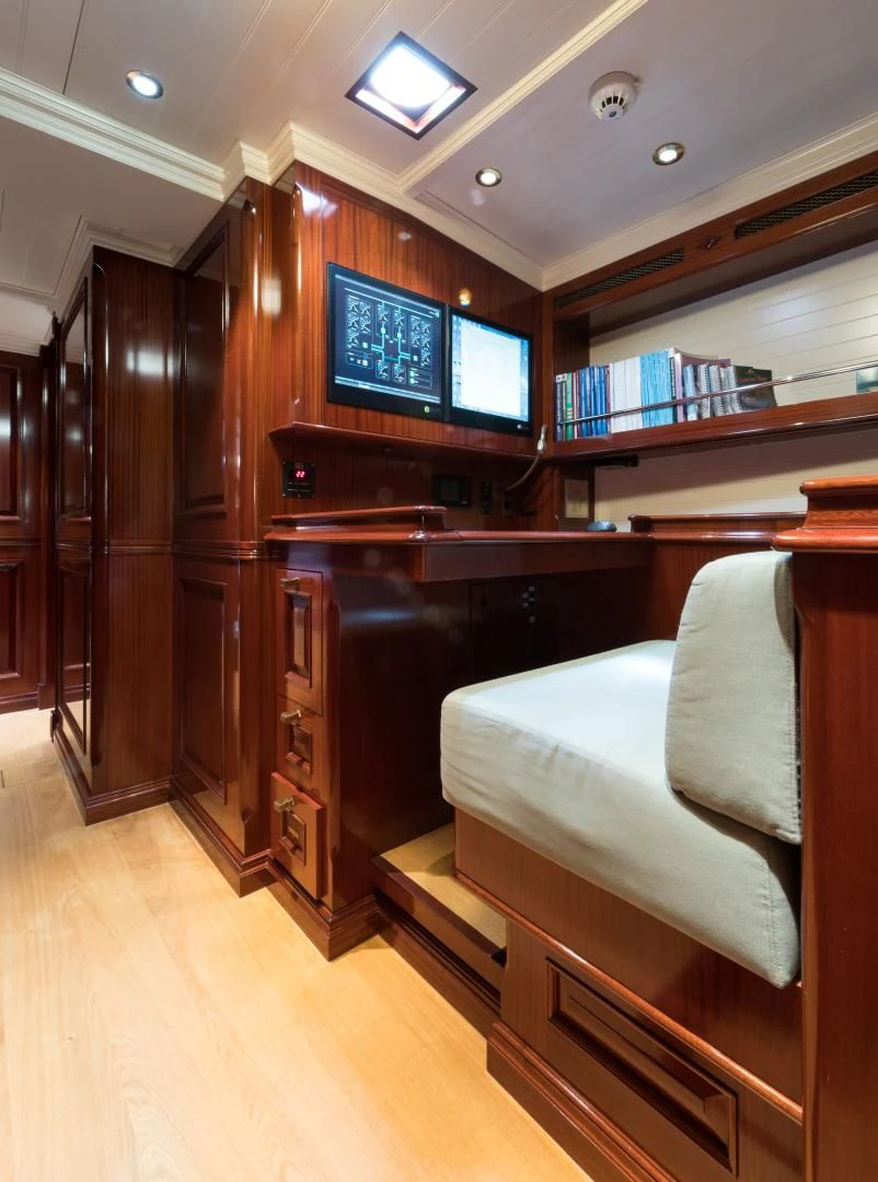 a room with a bed and a tv aboard RAINBOW Yacht for Sale
