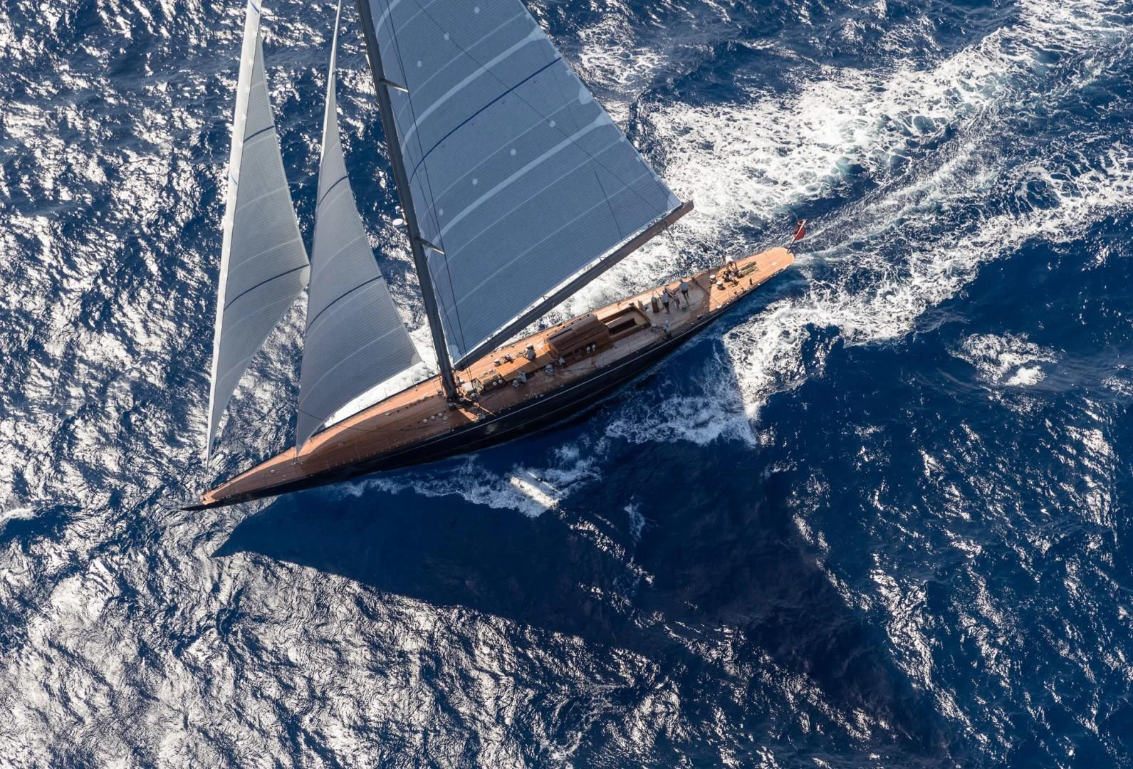 a space shuttle flying over earth aboard RAINBOW Yacht for Sale