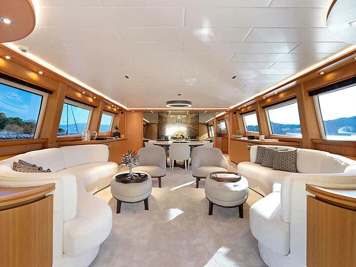 a room with a couch and a television aboard MAMMA MIA Yacht for Sale