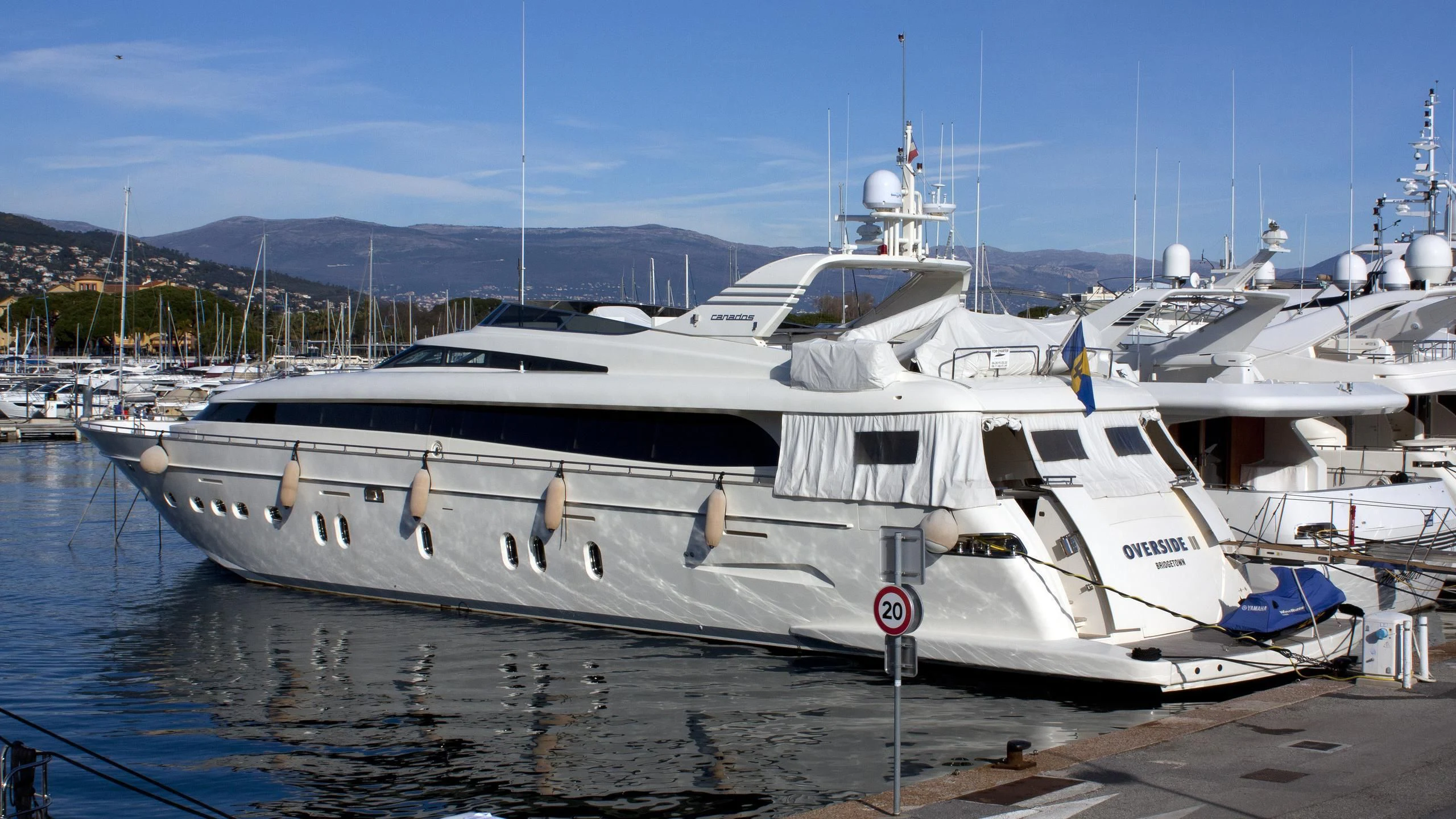a couple of boats are parked in a harbor aboard MAMMA MIA Yacht for Sale