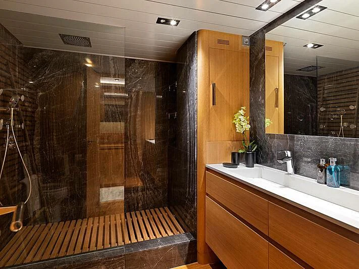 a bathroom with a large mirror aboard MAMMA MIA Yacht for Sale