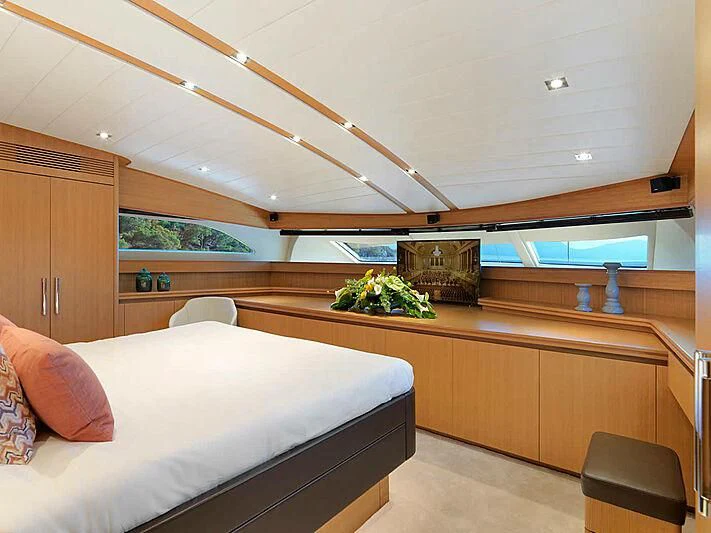 a room with a bed and a desk aboard MAMMA MIA Yacht for Sale