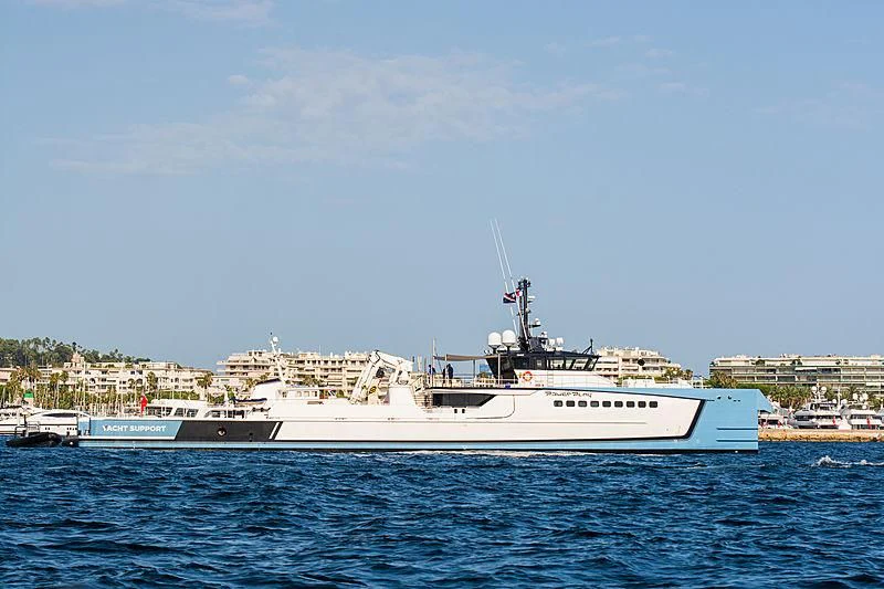 a large white boat in the water aboard POWER PLAY Yacht for Sale