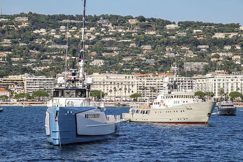 a couple of boats in the water aboard POWER PLAY Yacht for Sale