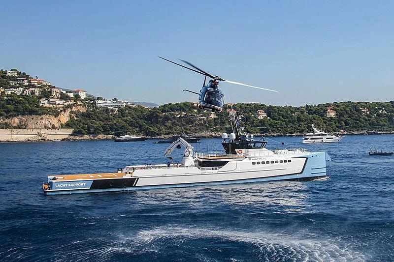 a helicopter flying over a boat aboard POWER PLAY Yacht for Sale