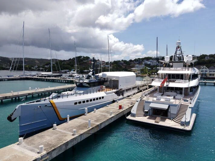 boats docked at a pier aboard POWER PLAY Yacht for Sale