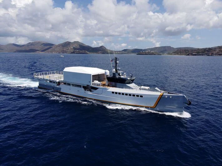 a white boat in the water aboard POWER PLAY Yacht for Sale