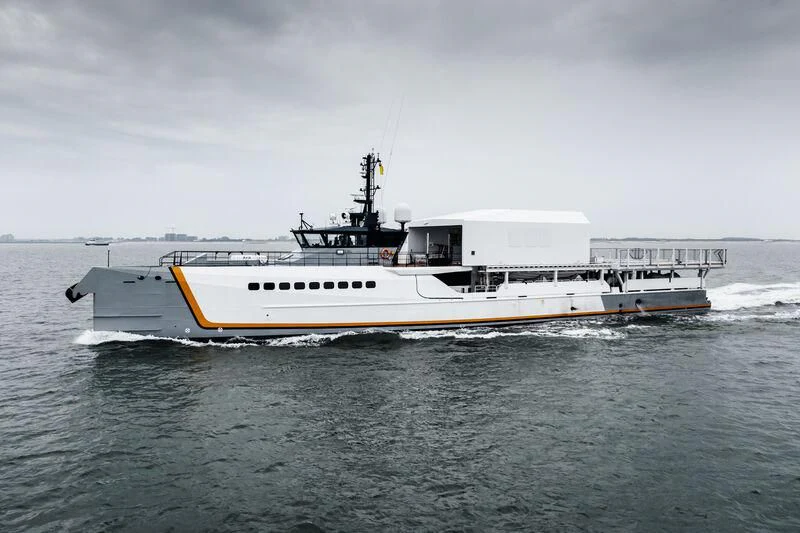 a large white boat in the water aboard POWER PLAY Yacht for Sale