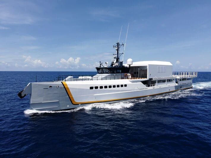a white boat in the water aboard POWER PLAY Yacht for Sale