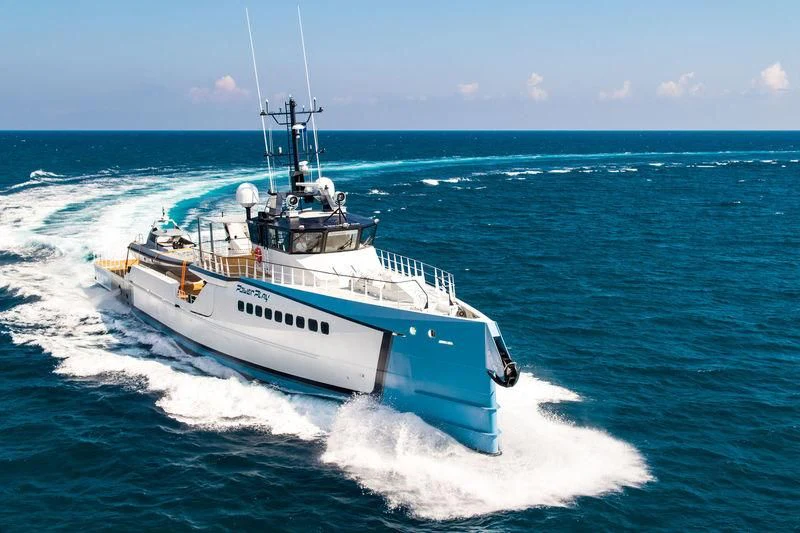 a boat on the water aboard POWER PLAY Yacht for Sale