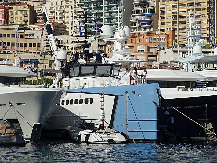 a boat docked at a port aboard POWER PLAY Yacht for Sale