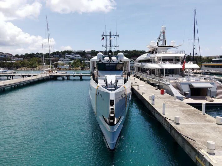 a boat is parked at a dock aboard POWER PLAY Yacht for Sale