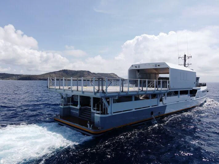 a boat on the water aboard POWER PLAY Yacht for Sale