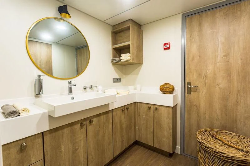 a bathroom with a large mirror aboard POWER PLAY Yacht for Sale