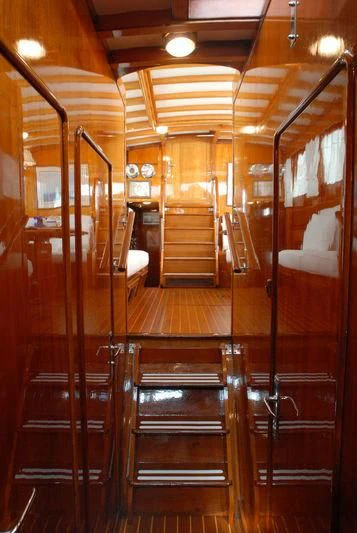 a wooden staircase in a building aboard GITANA IV Yacht for Sale