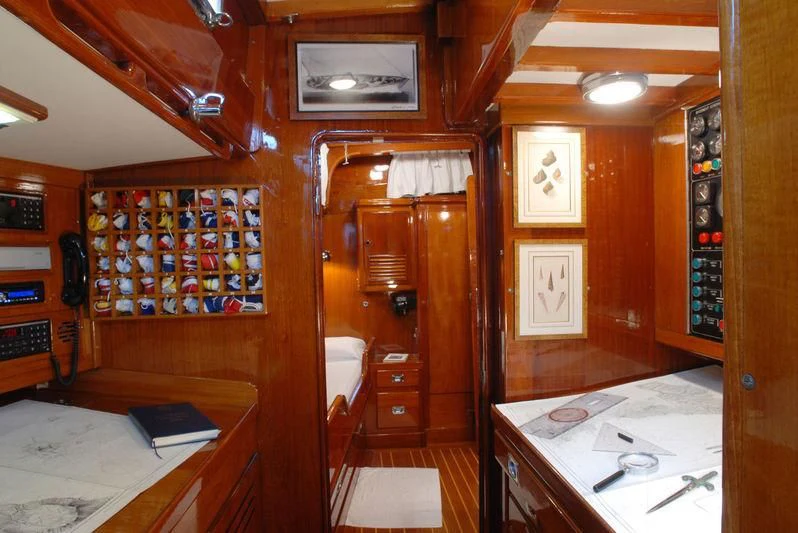 a room with a desk and a bed aboard GITANA IV Yacht for Sale