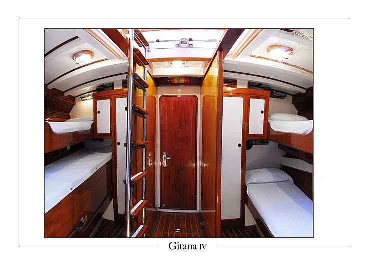 a room with bunk beds aboard GITANA IV Yacht for Sale
