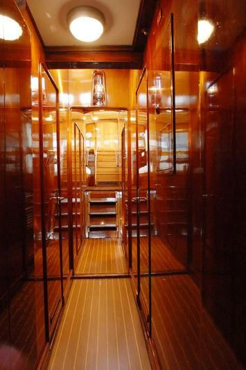 a hallway with wooden doors aboard GITANA IV Yacht for Sale