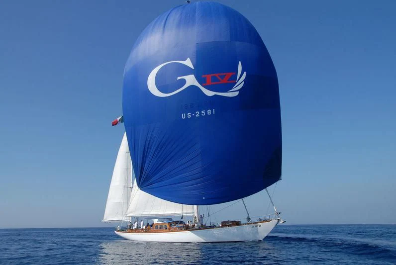a large blue and white boat in the water aboard GITANA IV Yacht for Sale