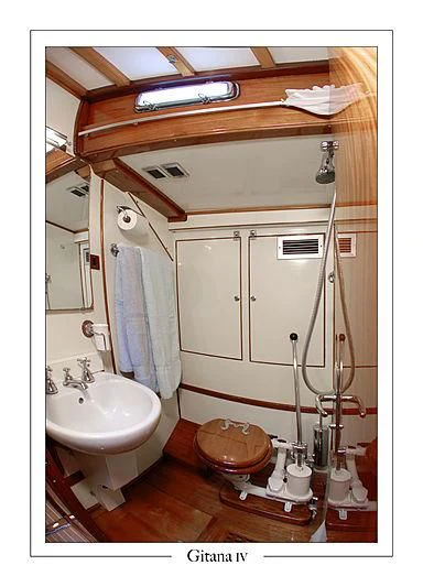 a bathroom with a sink and a toilet aboard GITANA IV Yacht for Sale