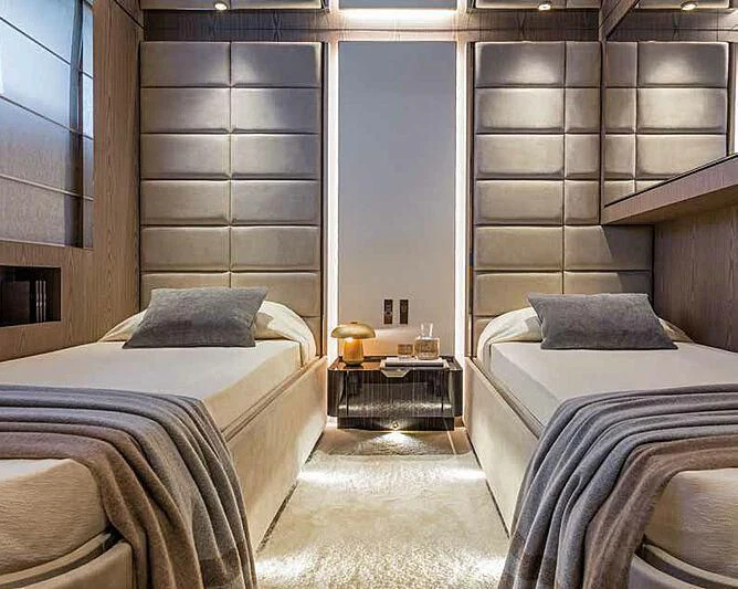 a room with two beds aboard RINO Yacht for Sale