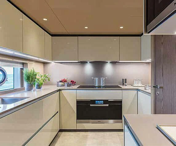 a kitchen with a black stove aboard RINO Yacht for Sale
