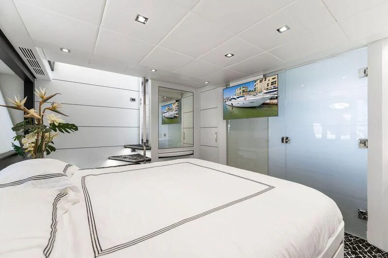 a large white room with a large white bathtub aboard HAWK Yacht for Charter