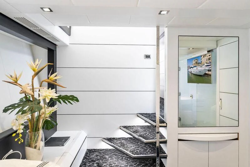 a room with a desk and a computer aboard HAWK Yacht for Charter