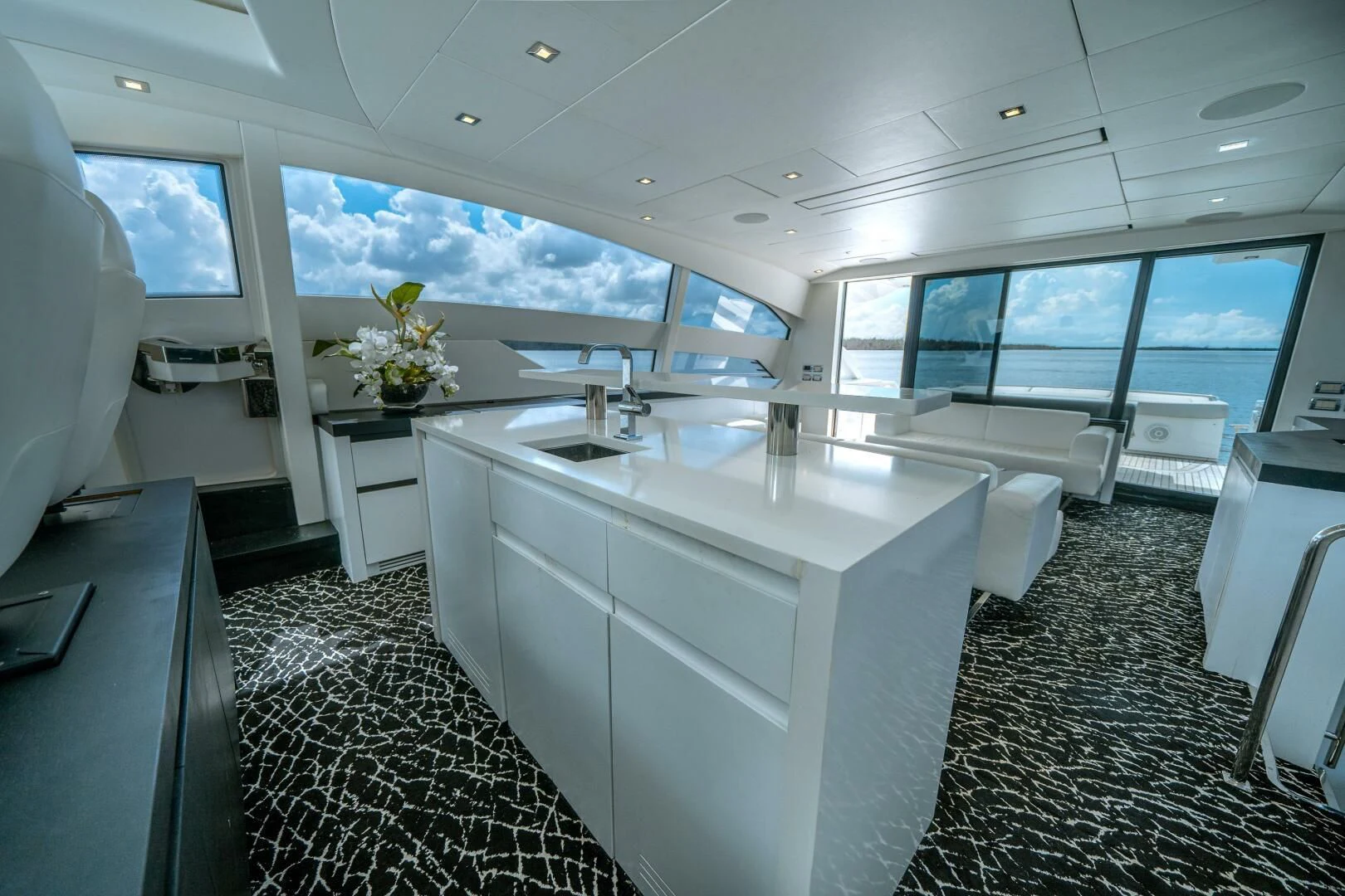 a large kitchen with a large window aboard HAWK Yacht for Charter
