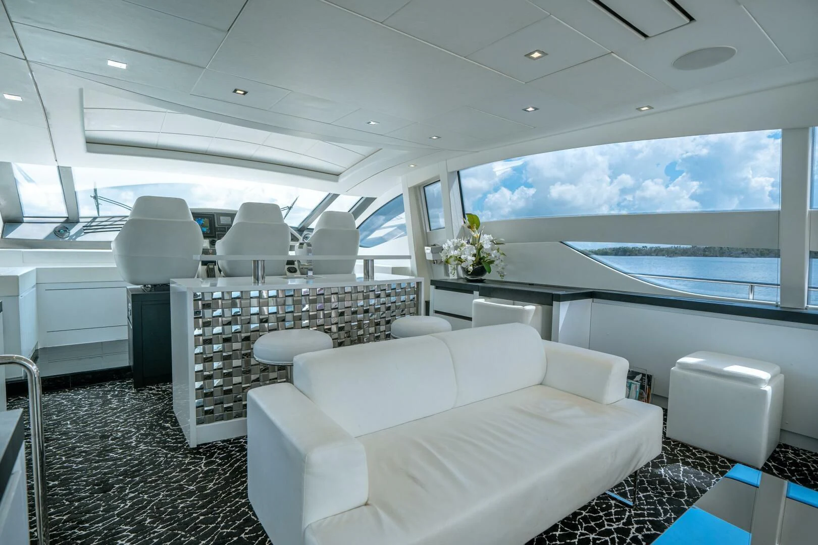 a room with a view of the ocean and the ocean aboard HAWK Yacht for Charter