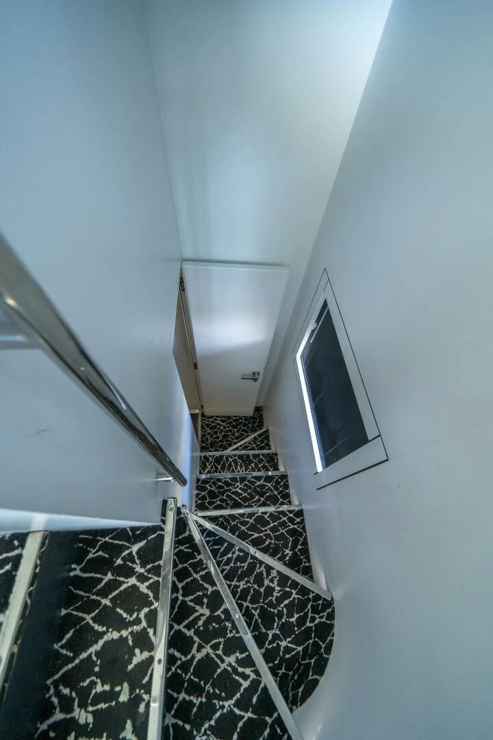 a tv on a wall aboard HAWK Yacht for Charter